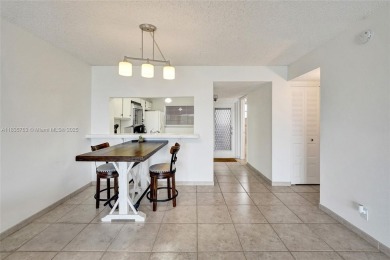 This charming 2-bedroom, 2-bathroom condo offers the perfect on Pine Island Ridge Country Club in Florida - for sale on GolfHomes.com, golf home, golf lot