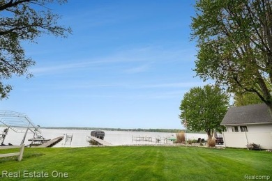 Welcome to 1171 North Shore, an exceptional waterfront property on Duck Lake Country Club in Michigan - for sale on GolfHomes.com, golf home, golf lot