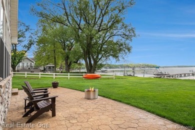 Welcome to 1171 North Shore, an exceptional waterfront property on Duck Lake Country Club in Michigan - for sale on GolfHomes.com, golf home, golf lot