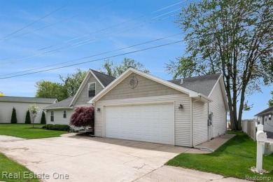 Welcome to 1171 North Shore, an exceptional waterfront property on Duck Lake Country Club in Michigan - for sale on GolfHomes.com, golf home, golf lot