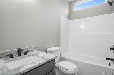 Fully finished with luxurious finishes throughout! Soaring on Copper Ridge Golf Club in Michigan - for sale on GolfHomes.com, golf home, golf lot