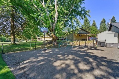 Nestled on the 7th green and 8th teebox of Avondale Golf Course on Avondale Golf and Tennis Club in Idaho - for sale on GolfHomes.com, golf home, golf lot