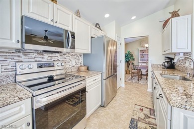 Welcome to your dream home in the prestigious Colonial Country on Colonial Country Club in Florida - for sale on GolfHomes.com, golf home, golf lot