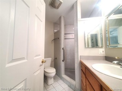 Beautifully updated end-unit brick condo in the highly desirable on Great Oaks Country Club in Michigan - for sale on GolfHomes.com, golf home, golf lot