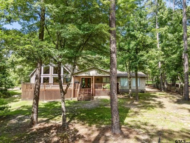 Welcome to your ideal lakefront retreat in the highly desirable on Holly Lake Ranch Golf Club in Texas - for sale on GolfHomes.com, golf home, golf lot