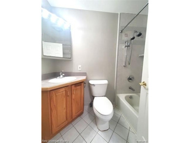 Beautifully updated end-unit brick condo in the highly desirable on Great Oaks Country Club in Michigan - for sale on GolfHomes.com, golf home, golf lot