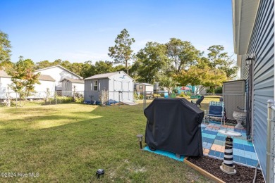 LOCATION IS EVERYTHING!!! This cute as can be home located in on Oyster Bay Golf Links in North Carolina - for sale on GolfHomes.com, golf home, golf lot