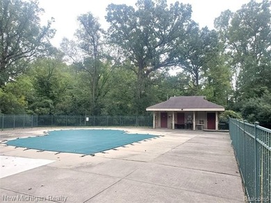 Beautifully updated end-unit brick condo in the highly desirable on Great Oaks Country Club in Michigan - for sale on GolfHomes.com, golf home, golf lot