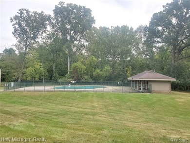 Beautifully updated end-unit brick condo in the highly desirable on Great Oaks Country Club in Michigan - for sale on GolfHomes.com, golf home, golf lot