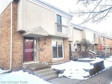 Beautifully updated end-unit brick condo in the highly desirable on Great Oaks Country Club in Michigan - for sale on GolfHomes.com, golf home, golf lot