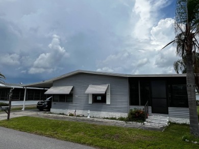 Community living in a great location with tons of activities in on Lake Henry Golf Club in Florida - for sale on GolfHomes.com, golf home, golf lot