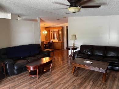 Community living in a great location with tons of activities in on Lake Henry Golf Club in Florida - for sale on GolfHomes.com, golf home, golf lot