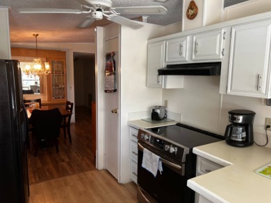 Community living in a great location with tons of activities in on Lake Henry Golf Club in Florida - for sale on GolfHomes.com, golf home, golf lot