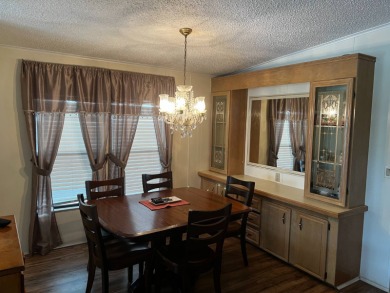 Community living in a great location with tons of activities in on Lake Henry Golf Club in Florida - for sale on GolfHomes.com, golf home, golf lot