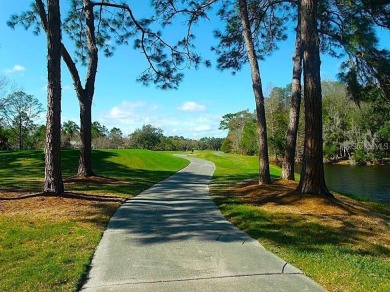 EXCEPTIONAL 2-bedroom, 2-bathroom condo, nestled within the on Hunters Green Country Club in Florida - for sale on GolfHomes.com, golf home, golf lot