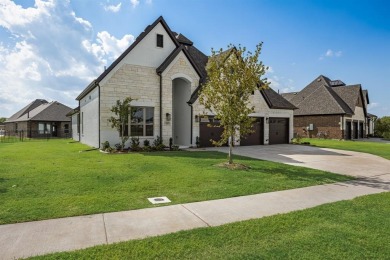 This highly sought-after single-story Altura Aspen floorplan is on Heath Golf and Yacht Club in Texas - for sale on GolfHomes.com, golf home, golf lot