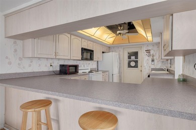 Welcome to this inviting waterfront community, where a tropical on Gulf Harbors Golf Course in Florida - for sale on GolfHomes.com, golf home, golf lot