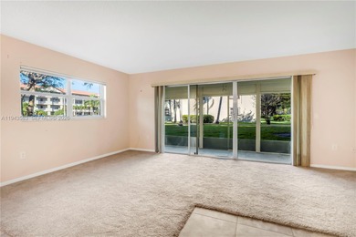 Ground floor corner Magnolia unit, with garden views, and on Flamingo Lakes Country Club in Florida - for sale on GolfHomes.com, golf home, golf lot