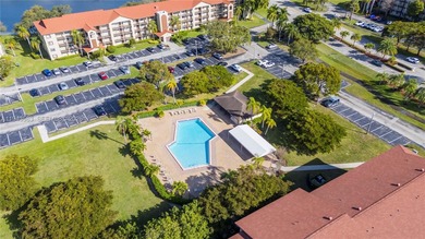 Ground floor corner Magnolia unit, with garden views, and on Flamingo Lakes Country Club in Florida - for sale on GolfHomes.com, golf home, golf lot
