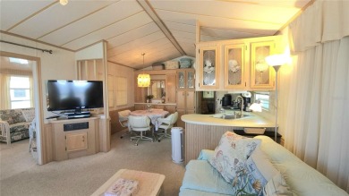 WELL KEPT CHARIOT MOBILE HOME IN ACTIVE 55+ COMMUNITY! One on River Run Golf Links in Florida - for sale on GolfHomes.com, golf home, golf lot