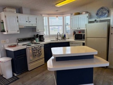 This home is in a 55 plus community with a monthly lot rent of on Crystal Lake Club in Florida - for sale on GolfHomes.com, golf home, golf lot