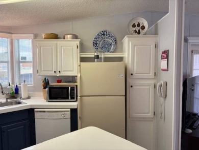 This home is in a 55 plus community with a monthly lot rent of on Crystal Lake Club in Florida - for sale on GolfHomes.com, golf home, golf lot