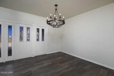 Take a look at this BEAUTIFUL home right on the Lake Havasu Golf on London Bridge Golf Course in Arizona - for sale on GolfHomes.com, golf home, golf lot