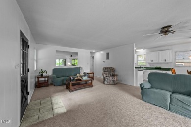 This cozy 2-bedroom, 2-bath home offers the perfect blend of on River Golf and County Club at Lake Royale in North Carolina - for sale on GolfHomes.com, golf home, golf lot