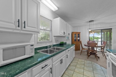 This cozy 2-bedroom, 2-bath home offers the perfect blend of on River Golf and County Club at Lake Royale in North Carolina - for sale on GolfHomes.com, golf home, golf lot