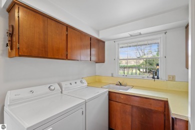 Mid-century modern classic, designed by renowned Charlevoix on Charlevoix Golf Club in Michigan - for sale on GolfHomes.com, golf home, golf lot