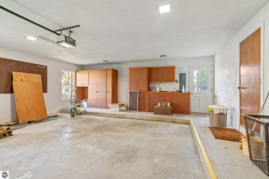 Mid-century modern classic, designed by renowned Charlevoix on Charlevoix Golf Club in Michigan - for sale on GolfHomes.com, golf home, golf lot
