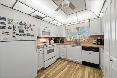 This beautifully renovated 2-bedroom, 2-bathroom condo in the on Sunrise Lakes Phase III in Florida - for sale on GolfHomes.com, golf home, golf lot