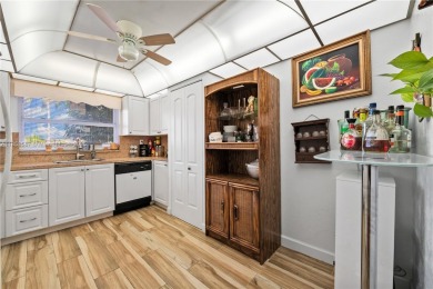 This beautifully renovated 2-bedroom, 2-bathroom condo in the on Sunrise Lakes Phase III in Florida - for sale on GolfHomes.com, golf home, golf lot