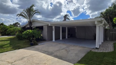 This home is located in the very popular Dana Shores on Rocky Point Golf Course in Florida - for sale on GolfHomes.com, golf home, golf lot