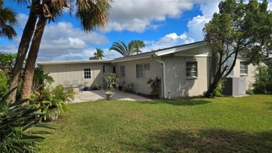 This home is located in the very popular Dana Shores on Rocky Point Golf Course in Florida - for sale on GolfHomes.com, golf home, golf lot
