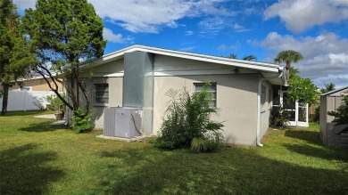 This home is located in the very popular Dana Shores on Rocky Point Golf Course in Florida - for sale on GolfHomes.com, golf home, golf lot