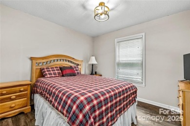 This beautifully updated turn-key furnished home is located on Rumbling Bald Resort on Lake Lure in North Carolina - for sale on GolfHomes.com, golf home, golf lot