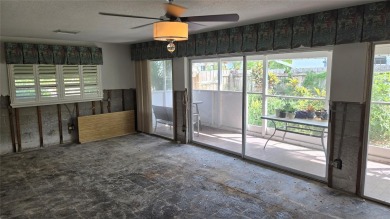 This home is located in the very popular Dana Shores on Rocky Point Golf Course in Florida - for sale on GolfHomes.com, golf home, golf lot
