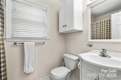 This beautifully updated turn-key furnished home is located on Rumbling Bald Resort on Lake Lure in North Carolina - for sale on GolfHomes.com, golf home, golf lot