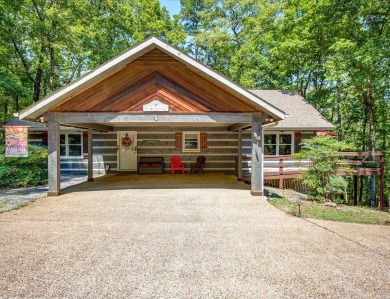 Discover your peaceful forest retreat in this inviting 3-bedroom on Cortez Golf Course in Arkansas - for sale on GolfHomes.com, golf home, golf lot