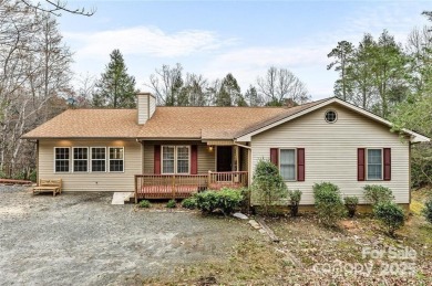 This beautifully updated turn-key furnished home is located on Rumbling Bald Resort on Lake Lure in North Carolina - for sale on GolfHomes.com, golf home, golf lot