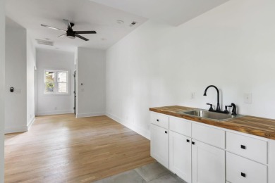 This beautifully updated charmer boasts dual primary suites -- on Snee Farm Country Club in South Carolina - for sale on GolfHomes.com, golf home, golf lot