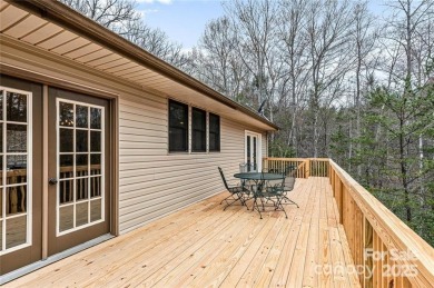 This beautifully updated turn-key furnished home is located on Rumbling Bald Resort on Lake Lure in North Carolina - for sale on GolfHomes.com, golf home, golf lot