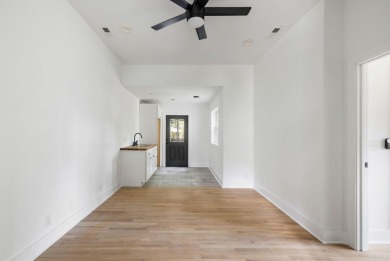 This beautifully updated charmer boasts dual primary suites -- on Snee Farm Country Club in South Carolina - for sale on GolfHomes.com, golf home, golf lot