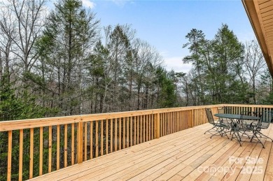 This beautifully updated turn-key furnished home is located on Rumbling Bald Resort on Lake Lure in North Carolina - for sale on GolfHomes.com, golf home, golf lot