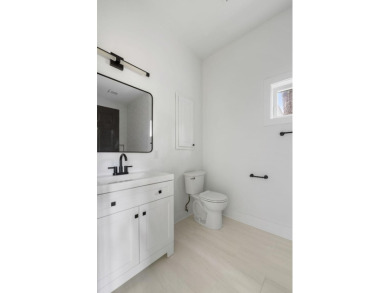This beautifully updated charmer boasts dual primary suites -- on Snee Farm Country Club in South Carolina - for sale on GolfHomes.com, golf home, golf lot