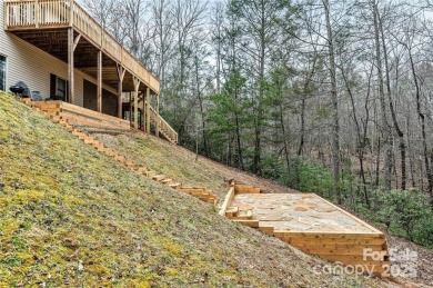 This beautifully updated turn-key furnished home is located on Rumbling Bald Resort on Lake Lure in North Carolina - for sale on GolfHomes.com, golf home, golf lot