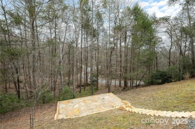 This beautifully updated turn-key furnished home is located on Rumbling Bald Resort on Lake Lure in North Carolina - for sale on GolfHomes.com, golf home, golf lot