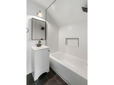 This beautifully updated charmer boasts dual primary suites -- on Snee Farm Country Club in South Carolina - for sale on GolfHomes.com, golf home, golf lot