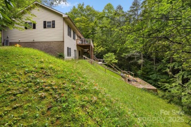 This beautifully updated, turn-key furnished home is nestled on Rumbling Bald Resort on Lake Lure in North Carolina - for sale on GolfHomes.com, golf home, golf lot